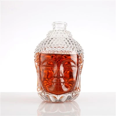 Bouteille d'alcool en verre de crâne en relief